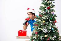 Young man drunk at home after christmas party [IBR125075774]
