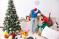 Young family cleaning apartment after christmas party [IBR125075785]