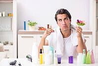 Young handsome man in the bathroom in hygiene concept [IBR125075791]