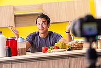 Young man blogging about food supplements [IBR125075804]