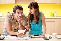 Young family struggling with personal finance [IBR125075808]