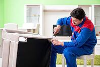 Repair contractor repairing broken furniture at home [IBR125094348]