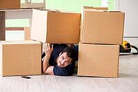 Man moving house with boxes [IBR125094355]