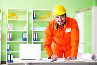 Construction supervisor planning new project in office [IBR125094390]