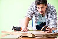 Woodworker working in his workshop [IBR125094401]