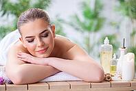 Woman during massage session in spa [IBR125094416]