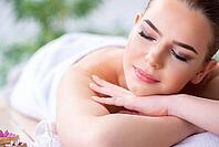 Woman during massage session in spa [IBR125094432]