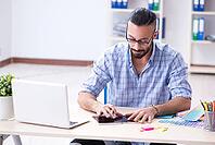 Young designer working in his studio on new project [IBR125094433]