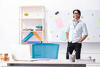 Young handsome male designer working in the office [IBR125118047]