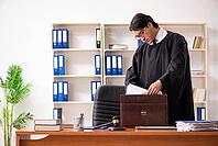 Young handsome judge working in court [IBR125118056]