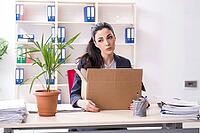 Young female employee being fired from her work [IBR125141675]