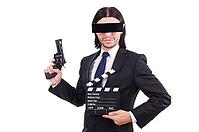 Man with movie board on white [IBR125141683]