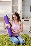 Young beautiful woman doing exercises at home [IBR125141685]