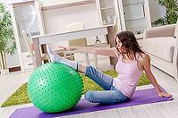 Young beautiful woman doing exercises at home [IBR125141690]
