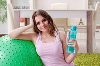 Young beautiful woman doing exercises at home [IBR125141694]