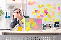Young female employee in conflicting priorities concept [IBR125141697]