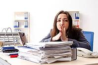 Young female employee unhappy with excessive work [IBR125141716]