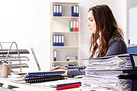 Young female employee unhappy with excessive work [IBR125141719]