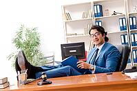 Young handsome judge sitting in courtroom [IBR125141725]