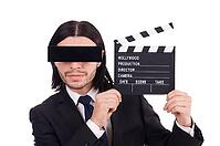 Man with movie board on white [IBR125141737]