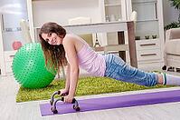 Young beautiful woman doing exercises at home [IBR125141747]