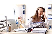 Young female employee unhappy with excessive work [IBR125141753]