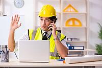 Male construction engineer working in the office [IBR125141764]