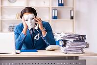 Male employee in the office in industrial espionage concept [IBR125141770]