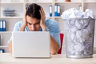 Businessman rejecting new ideas with lots of papers [IBR125141771]