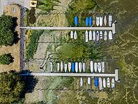 Drought on Lake Constance. The marina of Mannenbach-Salenstein in the canton of Thurgau is almost completely dry. Boats are dry at the dock and can no longer get into the water. aerial view. Mannenbach-Salenstein, Canton of Thurgau, Switzerland [IBR125163335]