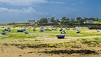 Moored boats rest in the harbour of Argenton in Finistère, Brittany, France. The sheltered waters, small fishing vessels and surrounding coastal setting reflect the traditional maritime character of this village on the rugged northwestern coast of Brittan [IBR125163376]