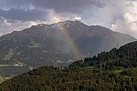View over Turripiano, rainbow in the Bormio 3000 area, Valdidentro, Sondrio, Italy [IBR125163394]
