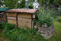 Large wild bee hotel made of clay, insect hotel, bee pasture, insect pasture, summer, July, wild bee, bumblebee, insect friendly, bee friendly, Crailsheim, Hohenlohe, Germany [IBR125164208]