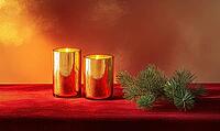 Two glass candle holders with golden candles, placed on a red velvet table runner with a small pine branch nearby. AI generated [IBR125167397]