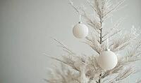 Minimalist Christmas tree ornamented with only white and beige decor. AI generated [IBR125167436]