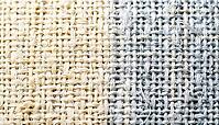 Cotton plain-weave fabric macro texture, left two-thirds in visible light warm ivory tones transitioning to right third in simulated near-infrared spectral response, cool silver-white, NIR spectroscopy textile fiber identification concept, studio shot, AI [IBR125167441]