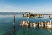 Shipping docks and wooden platforms on Lake Constance, moated castle, Bavaria, Germany [IBR125173447]
