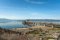 Jetty on Lake Constance at low tide in spring, moated castle, Bavaria, Germany [IBR125173449]