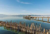 Shipping docks and wooden platforms on Lake Constance, moated castle, Bavaria, Germany [IBR125173458]