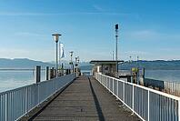 Jetty with a view of the Alps, moated castle am Lake Constance, Bavaria, Germany [IBR125173462]