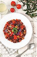 Sicilian caponata, vegetable stew, Italian cuisine, on a white plate, lifestyle, homemade dish, no people [IBR125177928]