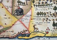 Old coloured map of Ceylon or Sri Lanka decorated with an elephant, by Jodocus Hondius from the Mercator Hondius Atlas, Amsterdam, 1633 [IBR125177954]