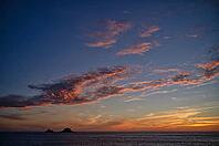 Sunset, sunset at sea, dramatic clouds, in the background rock formation The Brisons, Cot Valley Beach, Porth Nanven, coast, St Just in Penwith, Cornwall, England, Great Britain, Great Britain [IBR125177970]