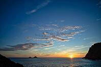 Evening, sunset at sea, The Brisons rock formation in the background, Cot Valley Beach, Porth Nanven, coast, St Just in Penwith, Cornwall, England, Great Britain, Great Britain [IBR125177988]
