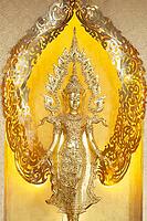 Symbolic depiction of the Buddha as an enlightened, radiant and regal figure in princely regalia, with a flame-shaped ornamental halo (aureole), at the Buddhist temple complex of Wat Phra That Sorn Kaew, Khao Kho Mountains, Phetchabun Province, Isan, Thai [IBR125178014]