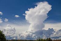 Dramatic cloud formation with impending storm clouds against a still blue sky [IBR125180322]