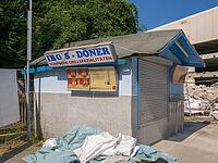 Demolition site with snack in front of demolition [IBR125180346]