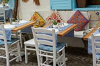 Empty furniture Empty Table And Chairs set on a traditional cobblestone street [IBR125180368]