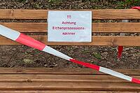 Close-up of a locked bench with warning sign about the risk of allergy due to oak procession spinners, Guxhagen, Hesse, Germany [IBR125180389]