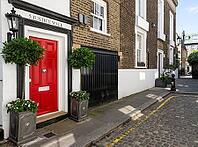 Classic red door with black frame and plants on both sides, white house facade, 5 Justice Walk, Chelsea, London, Great Britain, England, Great Britain [IBR125183198]